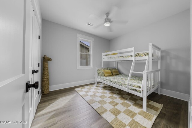 bedroom featuring wood-type flooring and ceiling fan