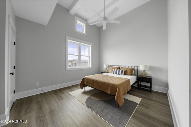 bedroom with a high ceiling, ceiling fan, beamed ceiling, and dark hardwood / wood-style floors