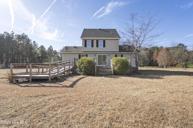 back of house featuring a wooden deck