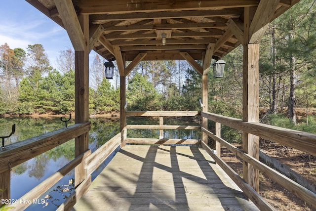 wooden deck with a water view