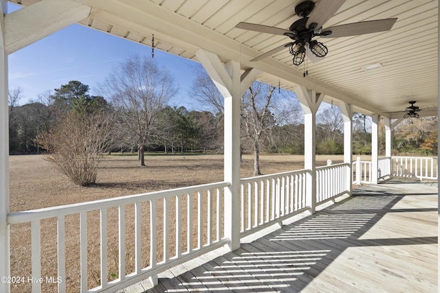 wooden deck with ceiling fan and a porch