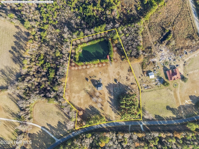 birds eye view of property with a rural view