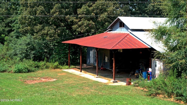 view of pole building with a yard