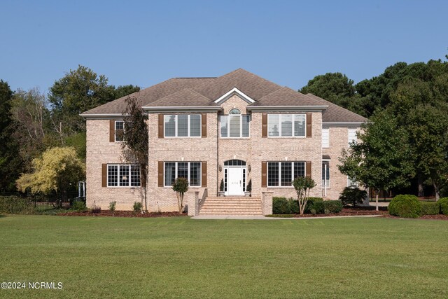 view of front of house with a front lawn