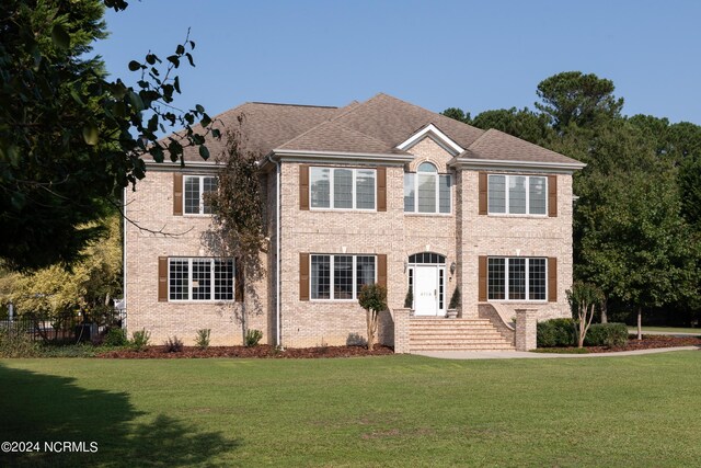 colonial house with a front lawn