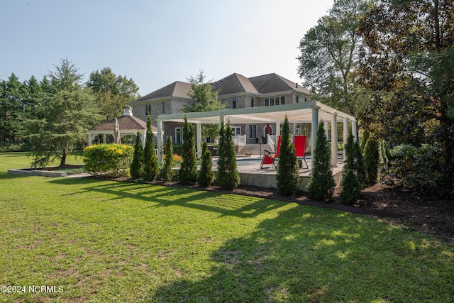 view of front of house featuring a front yard, a patio area, and a gazebo