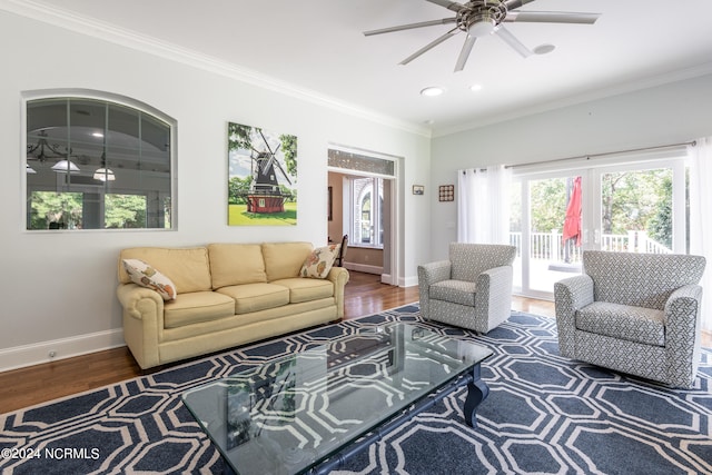 living room featuring ornamental molding, hardwood / wood-style floors, and ceiling fan