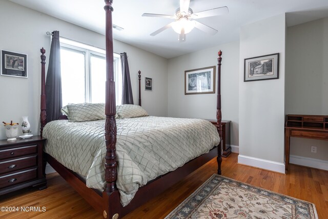 bedroom featuring wood-type flooring and ceiling fan