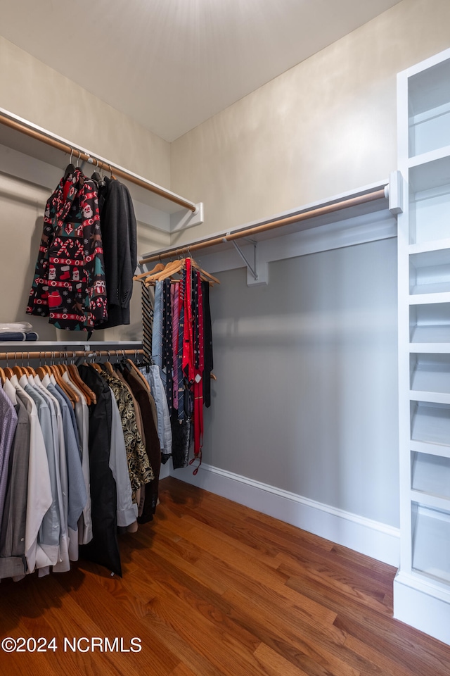 walk in closet featuring hardwood / wood-style flooring