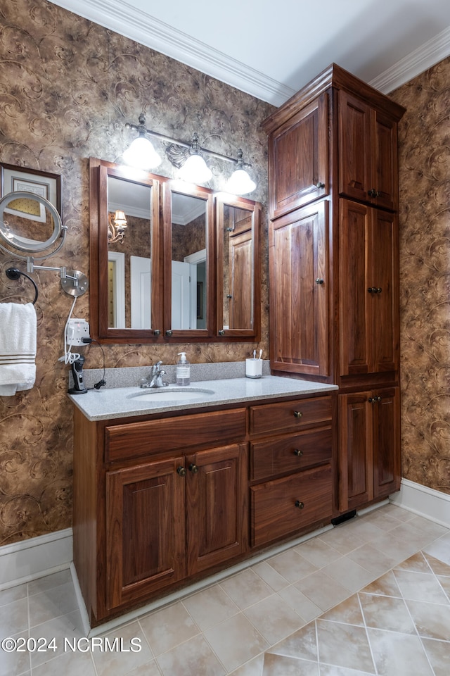 bathroom featuring vanity, ornamental molding, and tile patterned floors