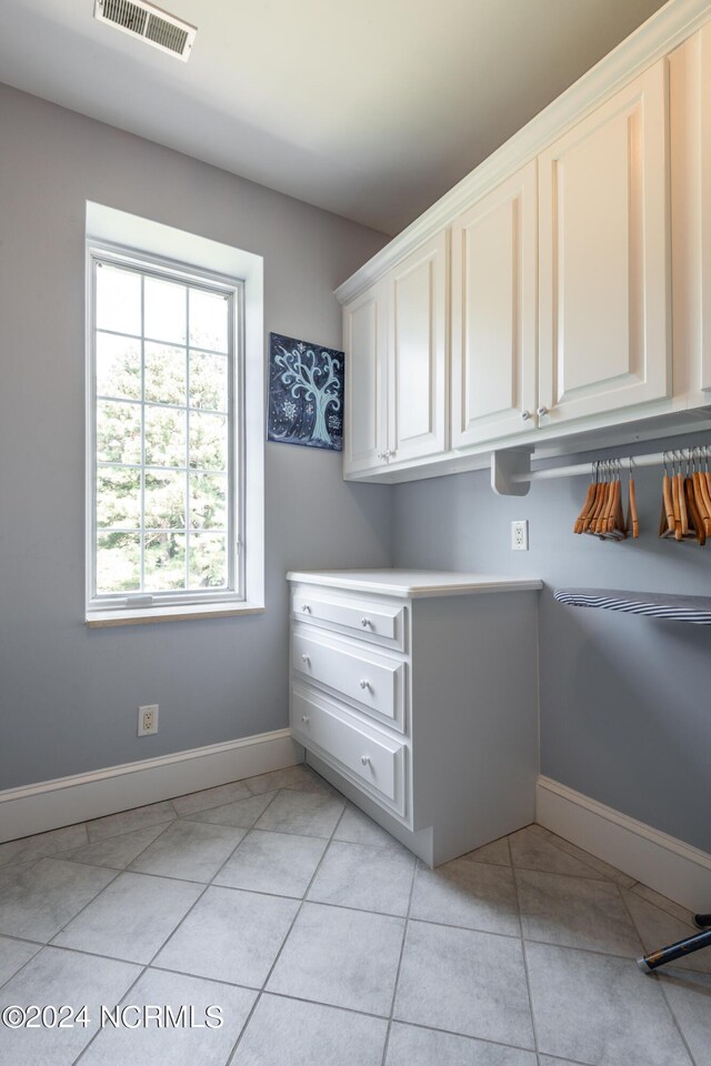 washroom with light tile patterned floors