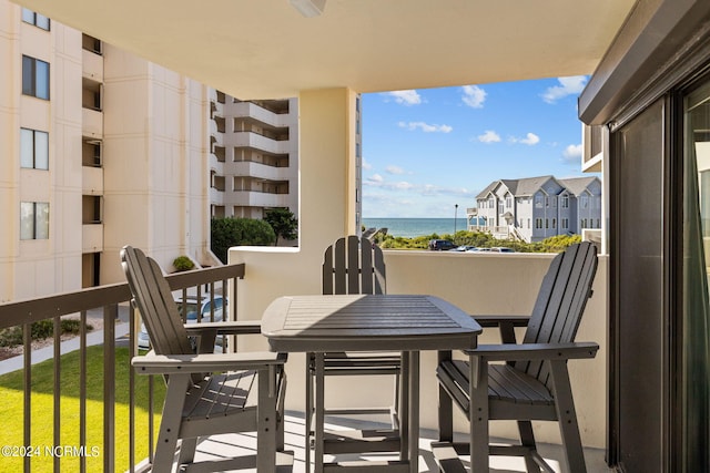 balcony featuring a water view