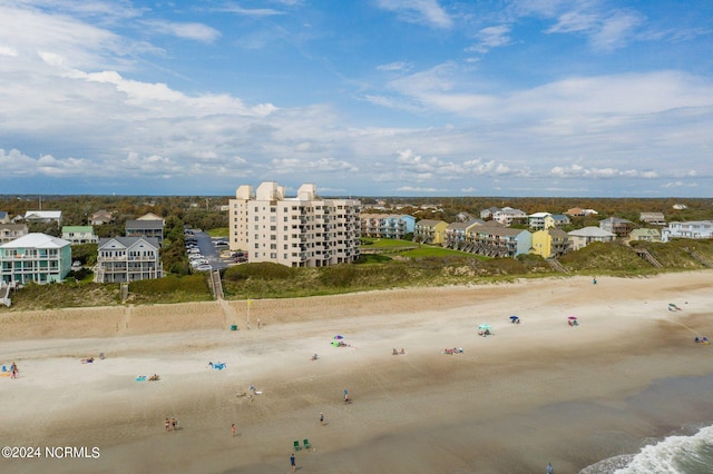 drone / aerial view with a view of the beach and a water view