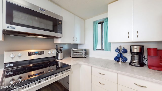 kitchen with white cabinets and stainless steel appliances