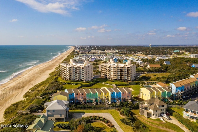 birds eye view of property featuring a water view and a view of the beach