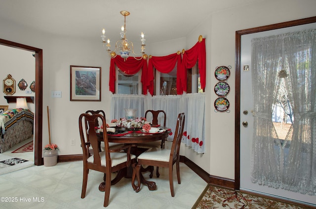 dining area with an inviting chandelier