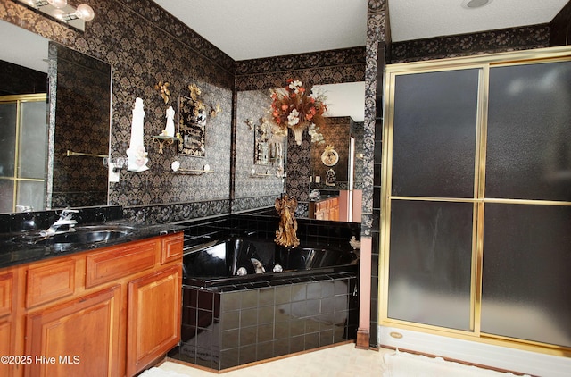 bathroom with independent shower and bath and vanity