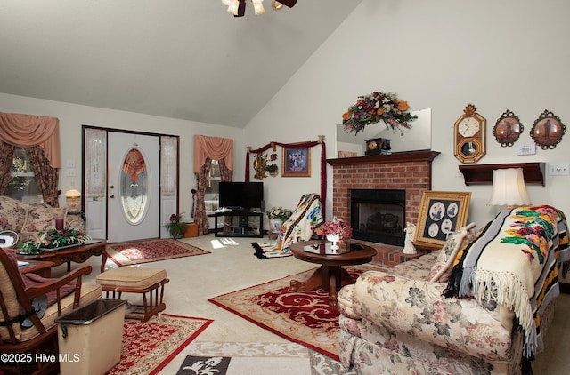 carpeted living room featuring high vaulted ceiling and a fireplace