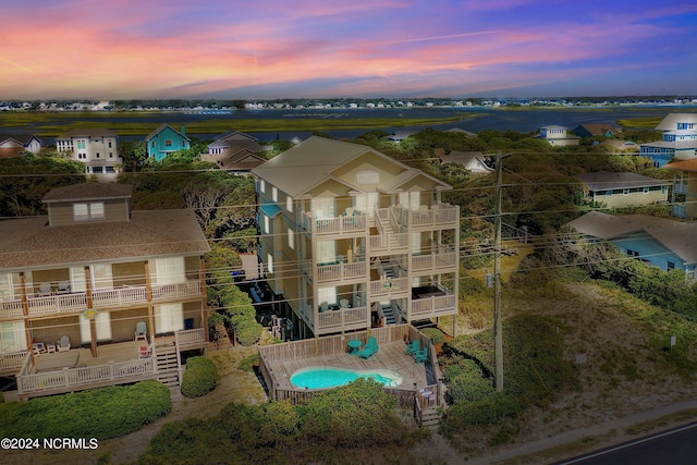 aerial view at dusk featuring a residential view