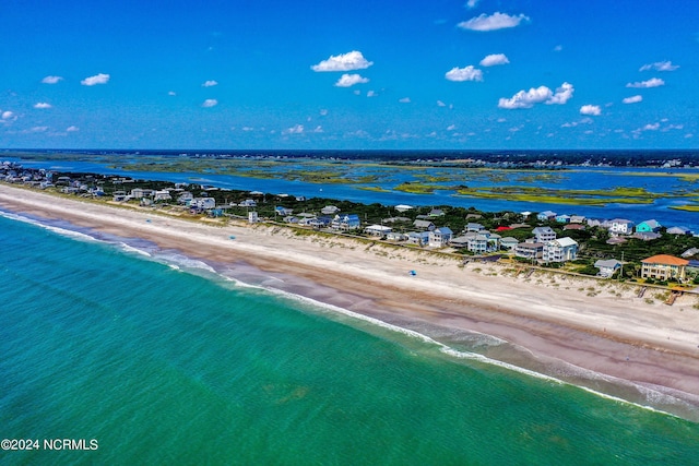 drone / aerial view featuring a view of the beach and a water view