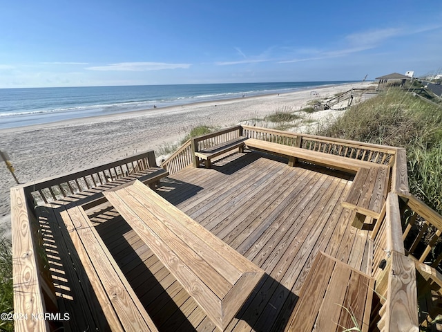 view of property's community featuring a view of the beach and a water view