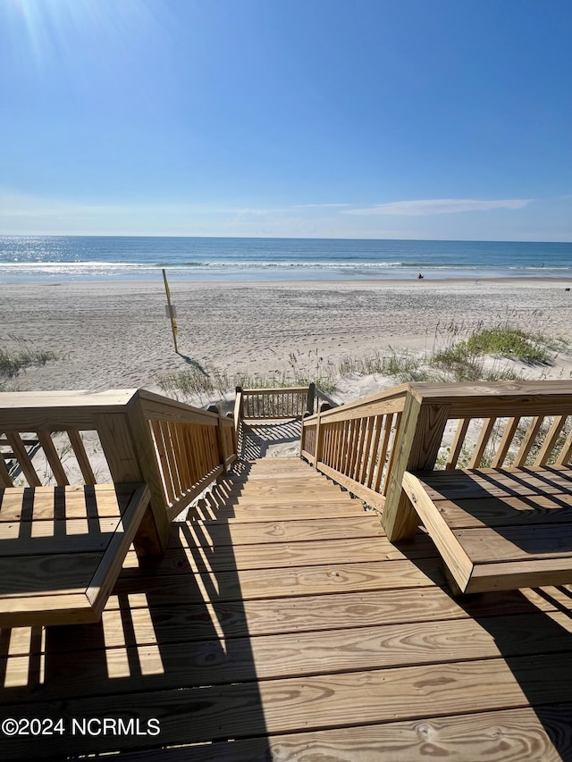 view of community featuring a water view and a view of the beach