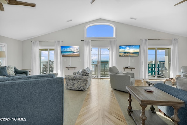 living area featuring visible vents and vaulted ceiling