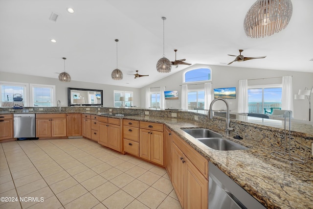 kitchen with light tile patterned floors, pendant lighting, and a sink