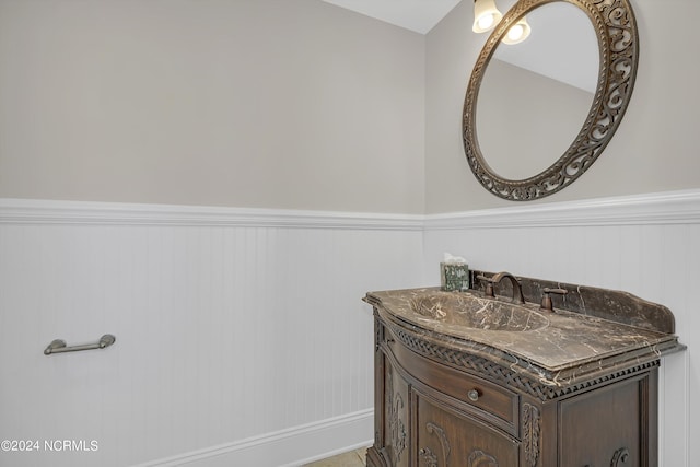 bathroom with wainscoting and vanity