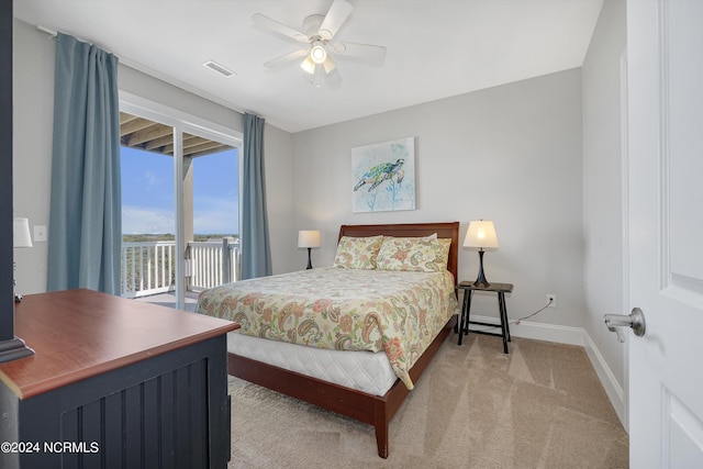 bedroom with ceiling fan, light carpet, visible vents, baseboards, and access to outside