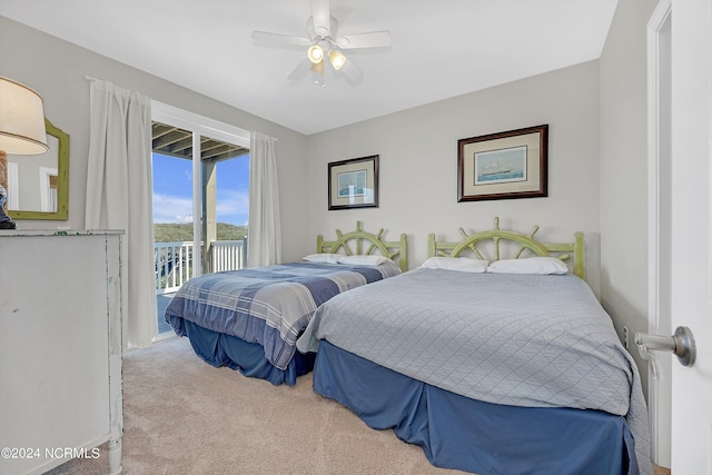 carpeted bedroom featuring access to exterior and ceiling fan