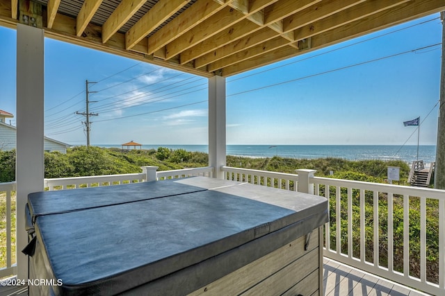 wooden deck featuring a water view