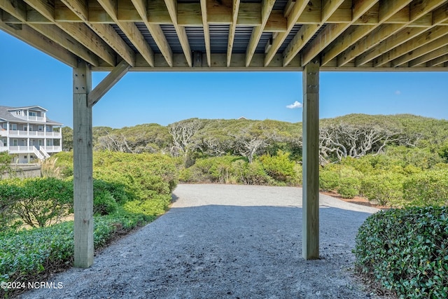 view of patio / terrace featuring a wooded view