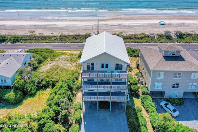 aerial view with a water view and a view of the beach