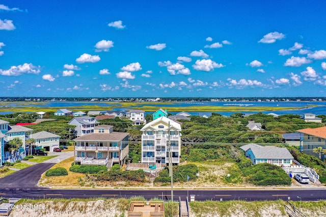 birds eye view of property featuring a residential view and a water view