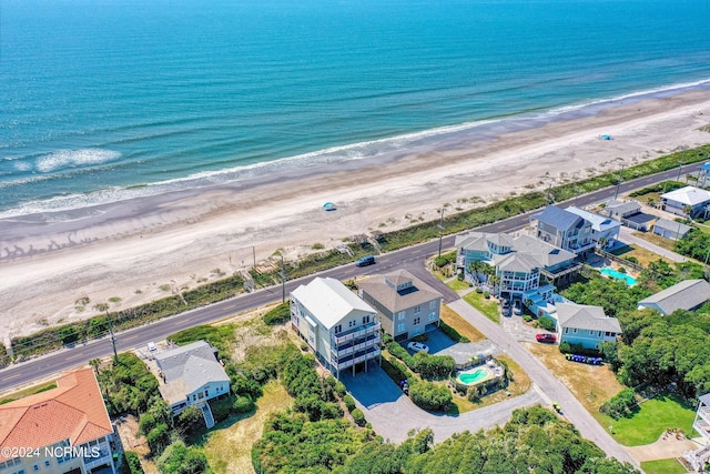 bird's eye view featuring a water view and a view of the beach