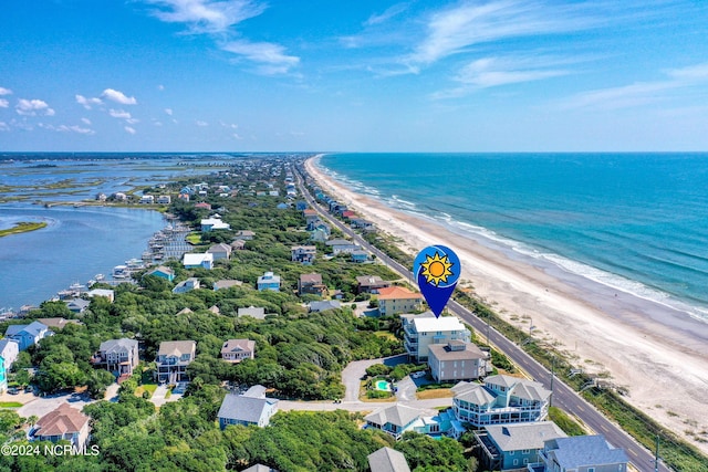 bird's eye view with a water view and a beach view