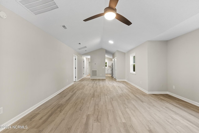 unfurnished living room featuring lofted ceiling, ceiling fan, and light hardwood / wood-style floors