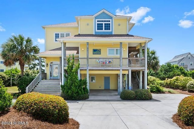 view of front facade featuring a porch and a carport