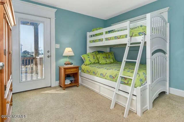 bedroom featuring light colored carpet