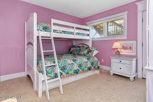 bedroom featuring light colored carpet