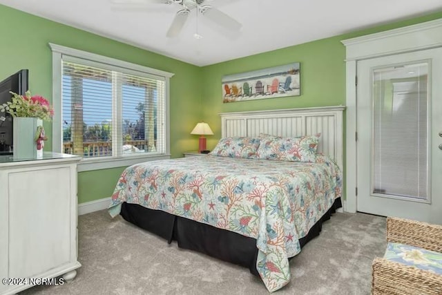 bedroom featuring carpet, a ceiling fan, and baseboards