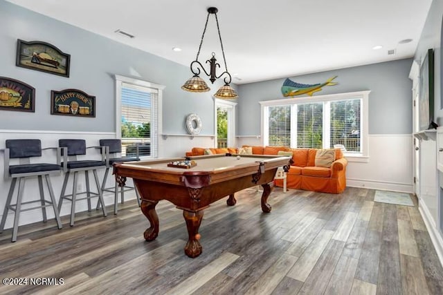 recreation room featuring pool table, plenty of natural light, wood finished floors, and visible vents