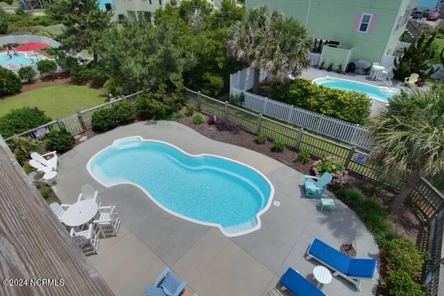 view of swimming pool with a patio area