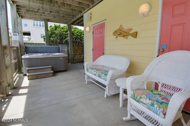 view of patio / terrace with a hot tub