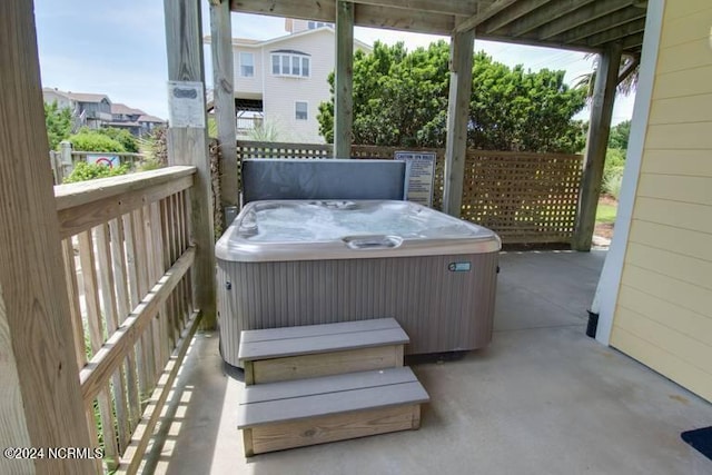 sunroom / solarium with a hot tub