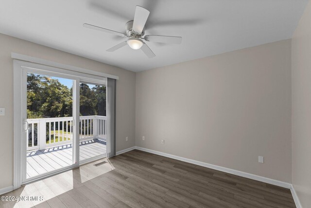 spare room with ceiling fan and hardwood / wood-style floors