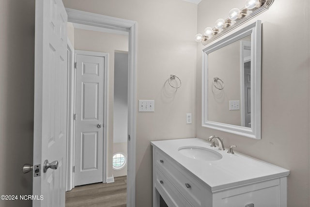 bathroom featuring hardwood / wood-style floors and vanity