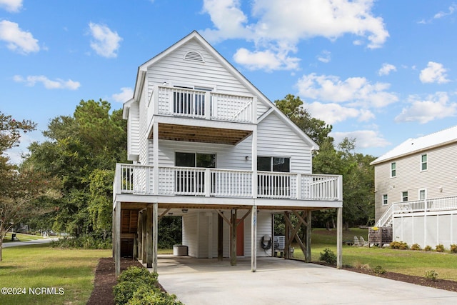 exterior space featuring a carport and a front yard