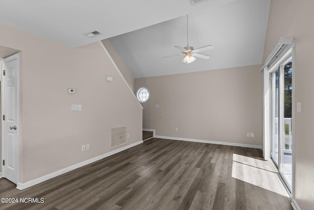 unfurnished living room with high vaulted ceiling, plenty of natural light, dark hardwood / wood-style floors, and ceiling fan